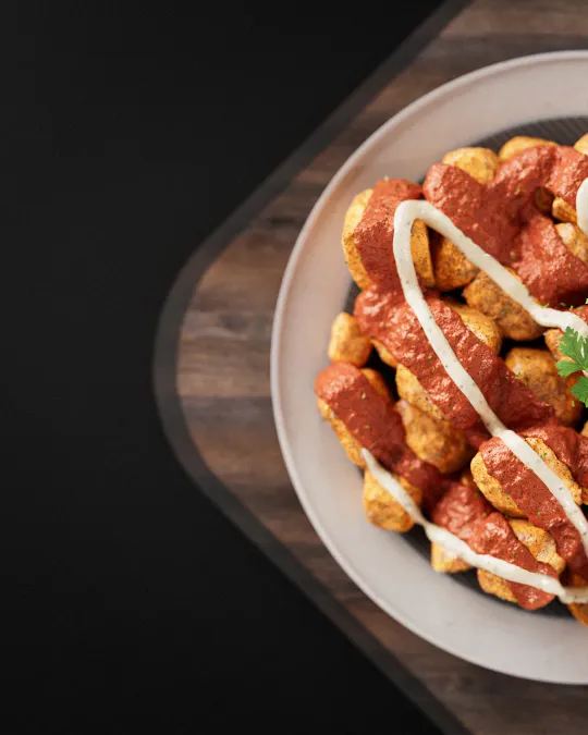 Mouth-watering 3D render of patatas bravas. Hyper-detailed texturing, V-Ray lighting, final retouch in Photoshop.