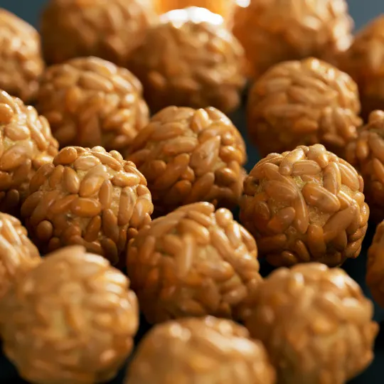 Photorealistic 3D render of a panellet with pine nuts. ZBrush sculpting, V-Ray render, Photoshop polish.