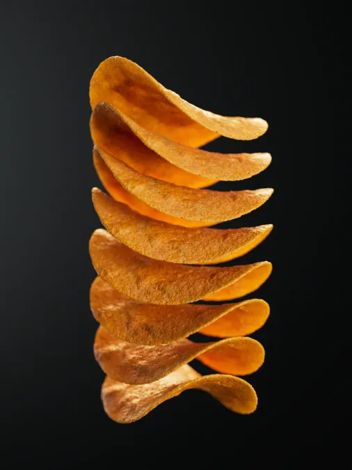 Photorealistic 3D render of a stack of Pringles. Maya dynamics, V-Ray render, Photoshop polish.